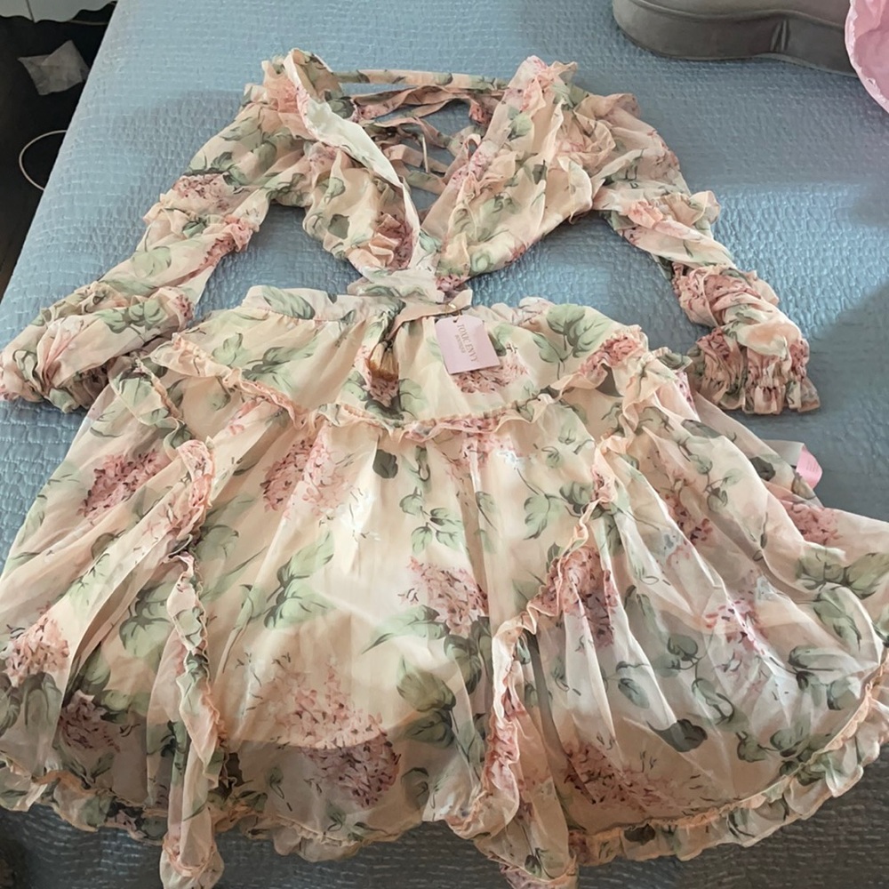 *Worn once floral ruffle dress. Open sides and open back